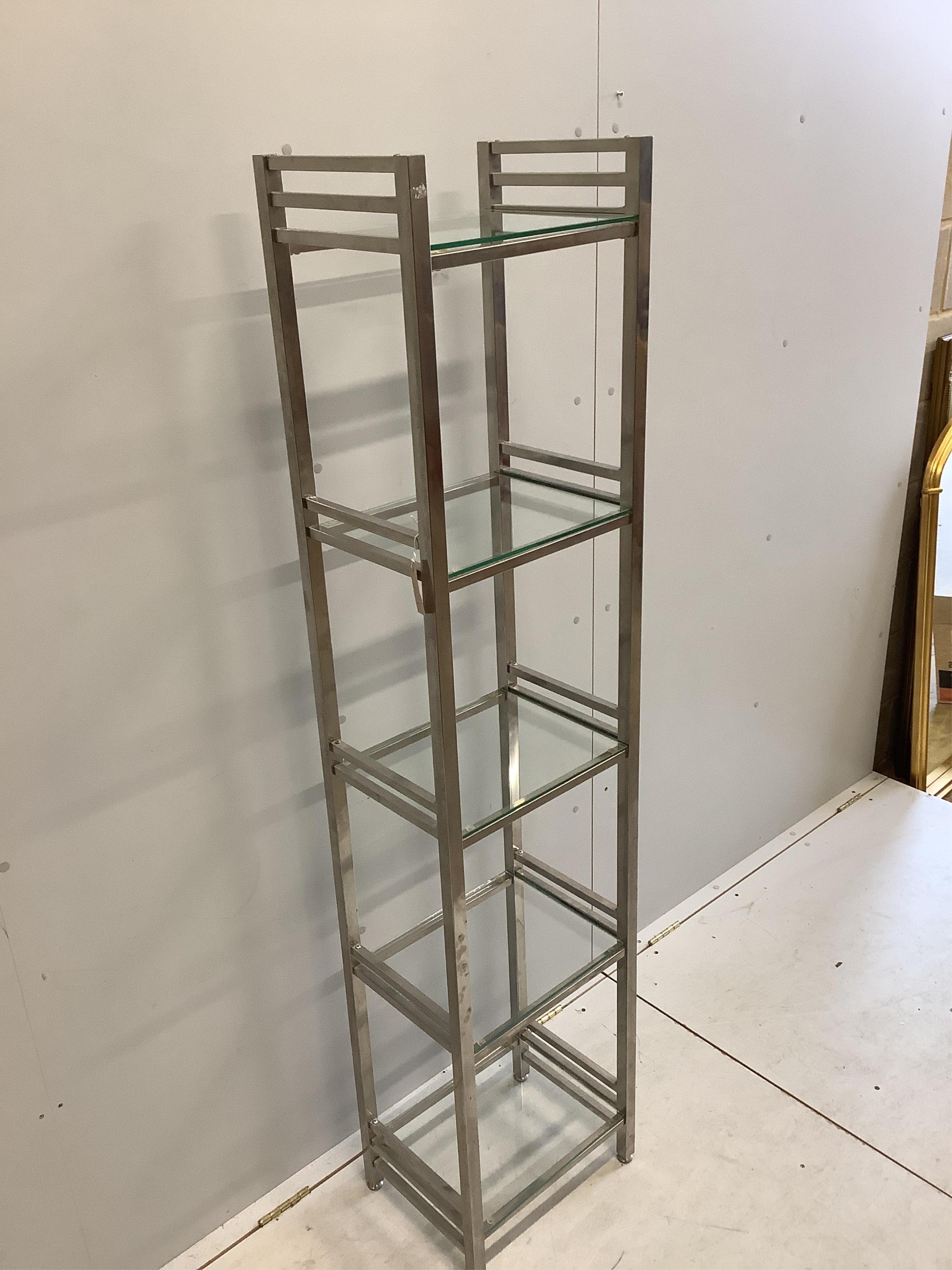 A chrome and glass five tier display unit, width 40cm, depth 30cm, height 176cm. Condition - fair